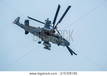 ROSTOV-ON-DON, RUSSIA - CIRCA AUGUST, 2017: Russian Air Force Mil Mi-28 Havoc attack combat helicopter in gray camouflage flying during aerial view during air show in Rostov-on-Don