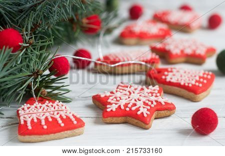 Gingerbread Bells, Stars, Garland Of Felted Beads And Fir Branches On A Light Background Christmas O