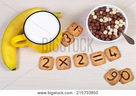 Healthy Breakfast For A Child Or Pupil. Chololate Cereals, Milk, Banana And Funny Cookies With Numbe
