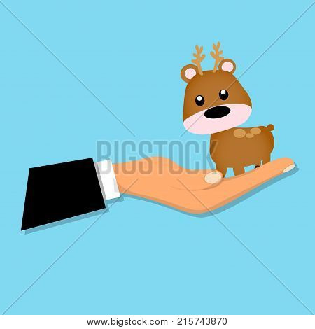 cartoon reindeer or deer sitting on a hand. Deer toy or character