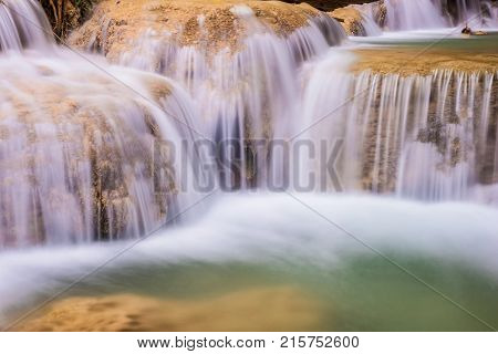 Mae Kae waterfall the Most Famous in Lampang Thailand. Beautiful silky waterfall flow through stones. Mountain stream running over rocks.