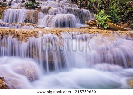 Mae Kae waterfall the Most Famous in Lampang Thailand. Beautiful silky waterfall flow through stones. Mountain stream running over rocks.