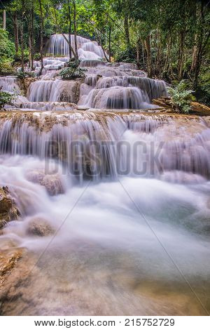Mae Kae waterfall the Most Famous in Lampang Thailand. Beautiful silky waterfall flow through stones. Mountain stream running over rocks.