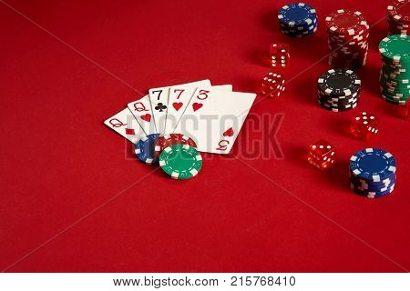 Poker cards and gambling chips on red background. Top view. Copy space. Still life. Flat lay. 2 Pair