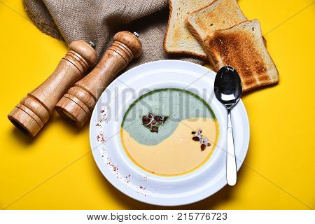Spinach And Pumpkin Cream Soup And Toast Bread Slices