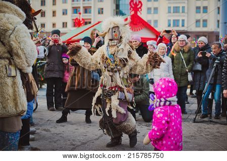 Russia. Moscow.Red square 26 Feb 2017. Carnival Maslenica . fancy dress scary on stilts amused the passers-by on the street