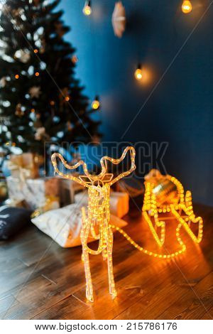 New Year glowing deer. Christmas reindeer sleigh lights effects.