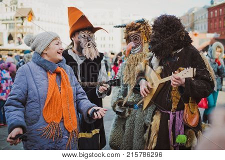 Russia. Moscow.Red square 26 Feb 2017. Carnival Maslenica . fancy dress scary on stilts amused the passers-by on the street