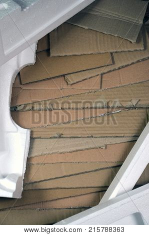 Background Image With A Lot Of Beige Cardboard Paper And Styrofoam Boxes Disgarded As Rubbish. The C