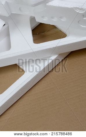 Background Image With Beige Cardboard Paper And Styrofoam Boxes Disgarded As Rubbish. The Concept Of