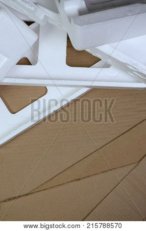 Background Image With Beige Cardboard Paper And Styrofoam Boxes Disgarded As Rubbish. The Concept Of
