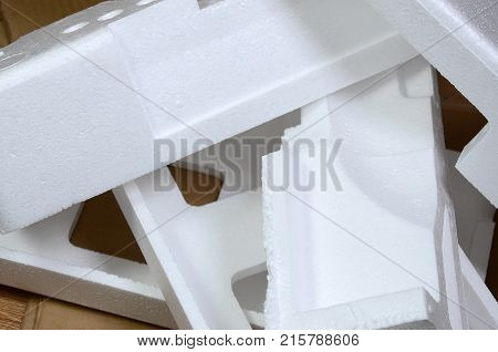 Background Image With Beige Cardboard Paper And Styrofoam Boxes Disgarded As Rubbish. The Concept Of