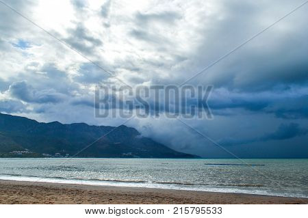 Montenegro beach in rainy weather. The sea and mountains of Montenegro. Budva. Becici
