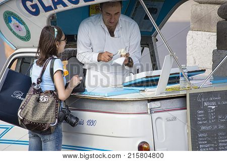 PARIS, FRANCE - JUNE 14, 2013: A Glaces Risi street vendor cart on the side of the road.