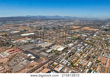 Looking to the southwest over Phoenix Arizona with views of the airport South Mountain and the Estrella Mountains in the distance