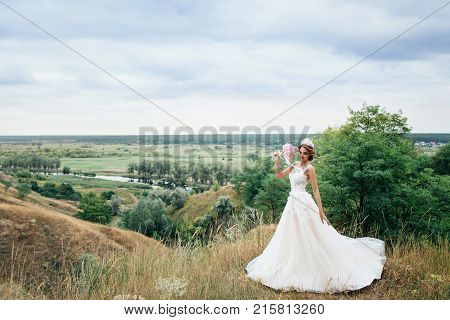 Beautiful Young Bride Girl Smiling, Standing In Wedding Dress.