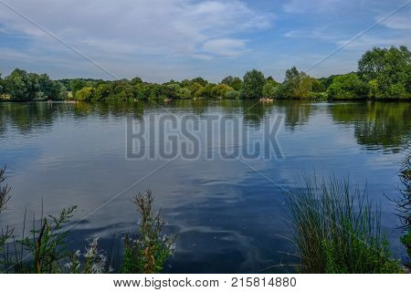 Essex Lake with boats and reflections on the water. Summer shot on a bright sunny day.