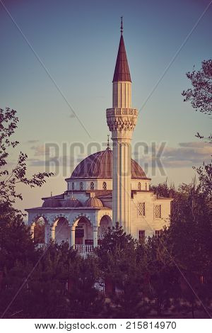 Beautiful old islamic mosqueon the background of evening sky. ukraine, mariupol, mosque in honor of the Ottoman Emperor