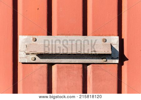 Old letterbox or mailbox in the metal gate door traditional way of delivering letters to the house close up