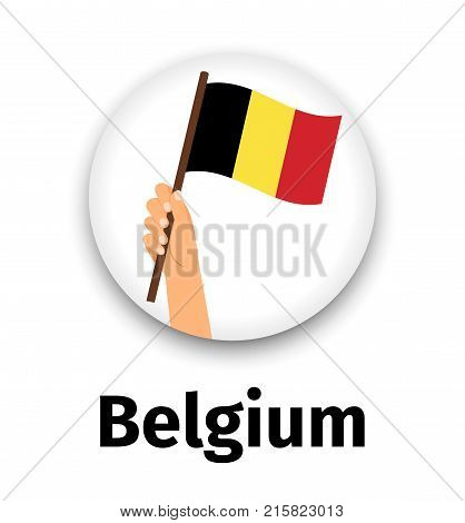 Belgium flag in hand, round icon with shadow isolated on white. Human hand holding flag, vector illustration