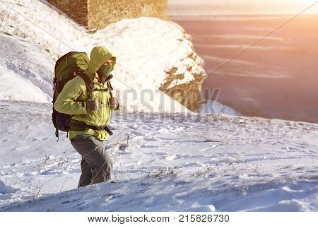 Climber in a snow storm. Man in mountains