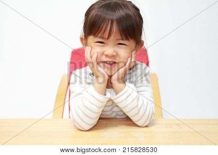 Japanese Girl Resting Her Chin In Her Hands (3 Years Old)