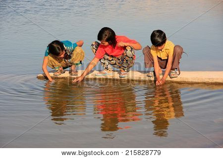 Khichan, India - February 12: Unidentified Kids Drink Water From Reservoir On February 12, 2011 In K