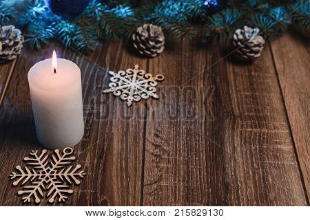 Christmas Candle On A Wooden Background