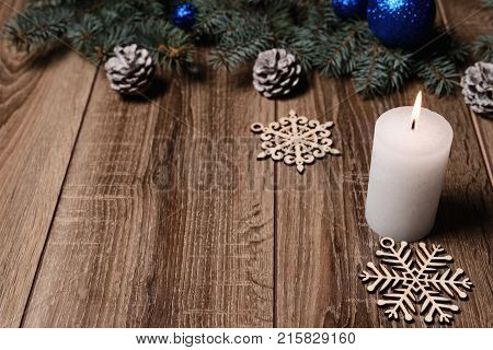 Christmas Candle On A Wooden Background