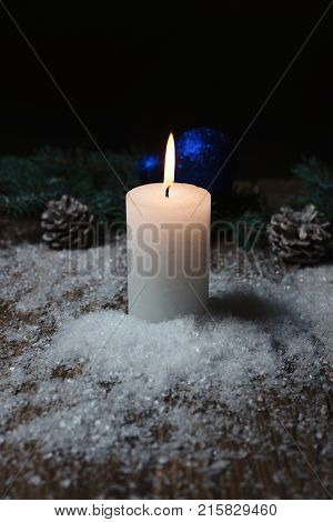 Christmas Candle On A Wooden Background