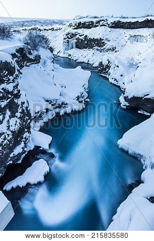Hraunfossar waterfall in winter. One of the most popular waterfall in Iceland, Europe.