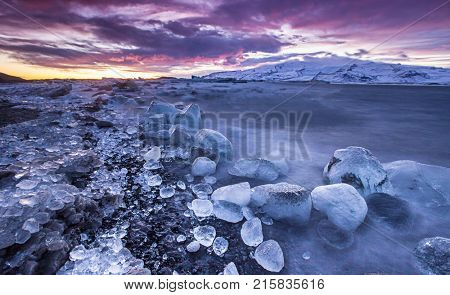 Icebergs in Jokulsarlon glacial lake during sunset, Iceland, Europe.