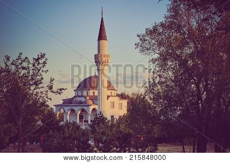 Ancient famous beautiful mosque with minarets on summer sunset. ukraine, mariupol, mosque in honor of the Ottoman Emperor