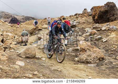 Kamchatka Peninsula, Russia - August 26, 2016: Tourists during the ascent to the active volcano Mutnovsky in Kamchatka.