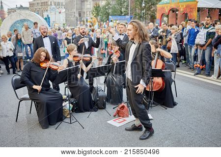 MOSCOW, RUSSIA - SEP 10, 2017: String quartet and singers on Tverskaya Street during celebration 870th anniversary of Moscow.