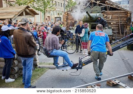 MOSCOW, RUSSIA - SEP 10, 2017: Group of cinematographers shooting a movie episode with legendary T-34 tank on Tverskaya Street during celebration 870th anniversary of Moscow.