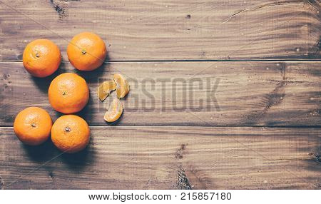 Mandarins on the wood table in christmas time