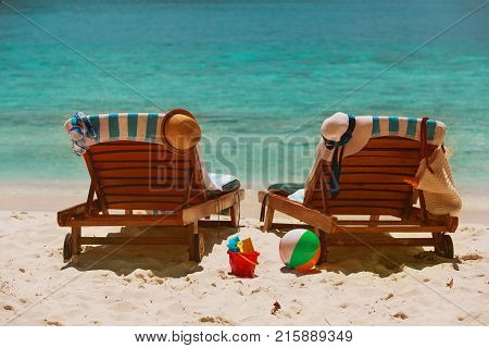 Two beach chairs on tropical sand beach vacation