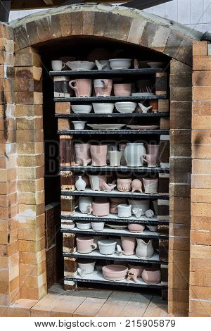 Fully packed fire brick soda kiln oblique view handmade hobby vertical aspect
