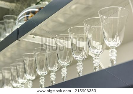 Closeup of emplty glasses on shelf in restaurant