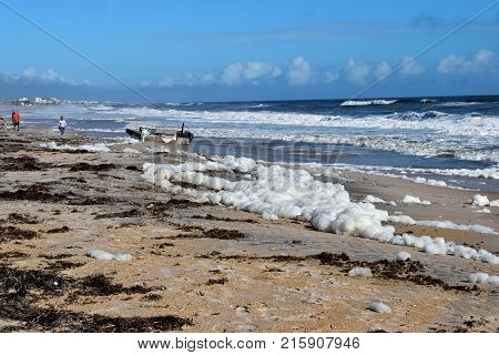 NORTH BEACH, FLORIDA, USA - OCTOBER 06, 2017: Debris on the beach showing a cement dock in the background caused by hurricane Irma hitting on the east coast of Florida on September 11, 2017.