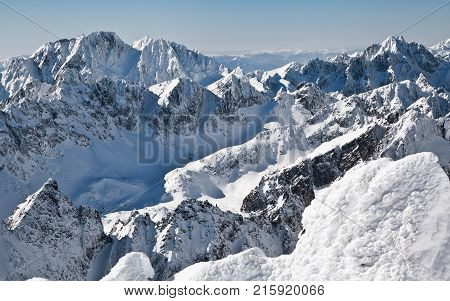 Beautiful snowy peaks in winter. View from peak Lomnicky stit in High Tatras mountains Slovakia