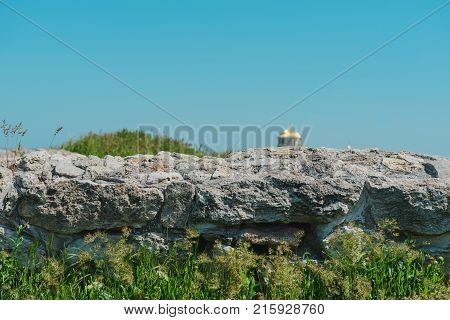 Landscape background- ruins of ancient buildings and facilities. Antiquity destroyed by time and the adverse environment- aged architecture