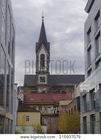 Czech republic Prague Karlin November 21 2017: view from business buildings corso karlin on old house and church Saints Cyril and Methodius