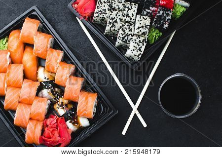 Sushi In A Black Container On A Wooden Table Colorful And Beautiful