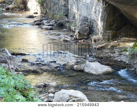 Mountain Caucasian river surrounded by picturesque autumn nature