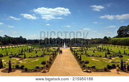 East Molesey, UK - May 26, 2015 - A view of Hampton Court Palace, a royal palace in the borough of Richmond upon Thames, London, England.
