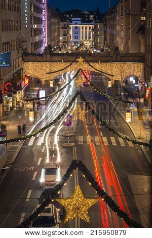STOCKHOLM SWEDEN - DECEMBER 9 2016: Night view over Kungsgatan a central Stockholm street decorated with Christmas lights during holiday season
