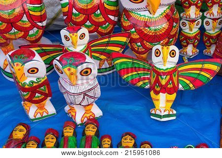 Colorful owls made of wood. Handicrafts on display during the Handicraft Fair in Kolkata earlier Calcutta West Bengal India. It is the biggest handicrafts fair in Asia.