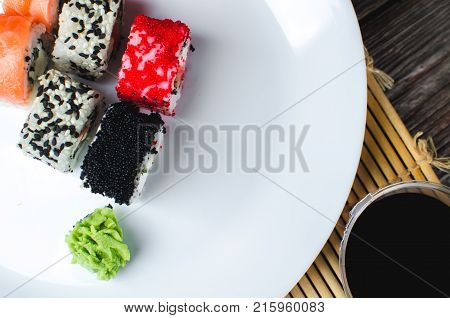 On The Plate Is White, Lined With Different Rolls, Sushi